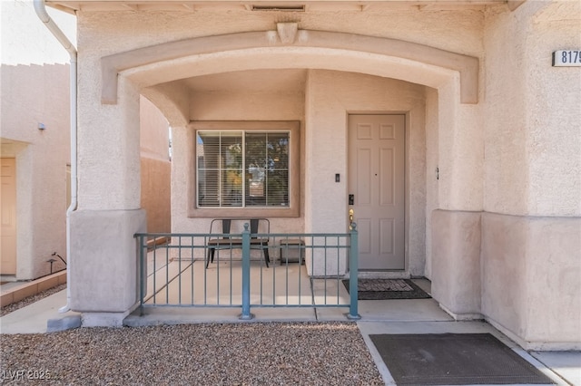 8179 Palace Monaco Ave, Las Vegas, NV 89117 - entrance to property with a porch and stucco siding