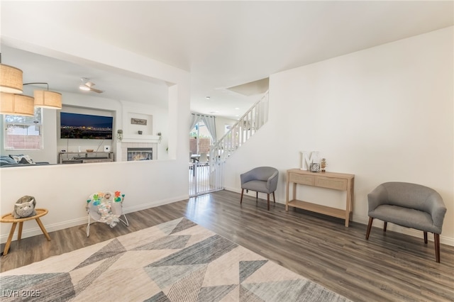 8179 Palace Monaco Ave, Las Vegas, NV 89117 - living area with stairs, wood finished floors, and a tile fireplace