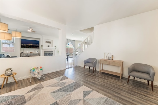 8179 Palace Monaco Ave, Las Vegas, NV 89117 - sitting room featuring stairway, wood finished floors, and a tile fireplace