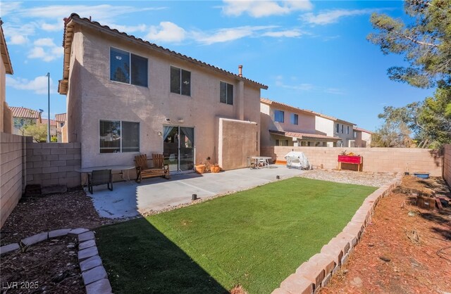 8179 Palace Monaco Ave, Las Vegas, NV 89117 - back of house featuring a fenced backyard, stucco siding, and a patio area