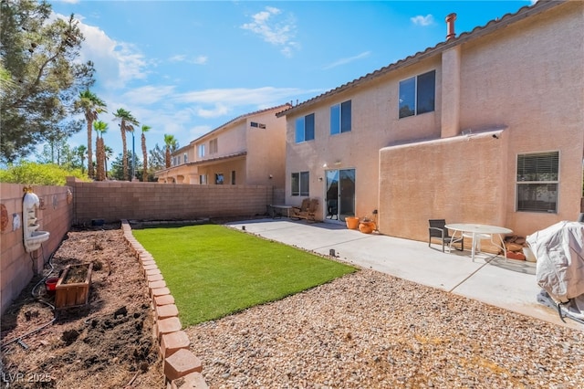 8179 Palace Monaco Ave, Las Vegas, NV 89117 - rear view of house featuring a fenced backyard, stucco siding, and a patio area