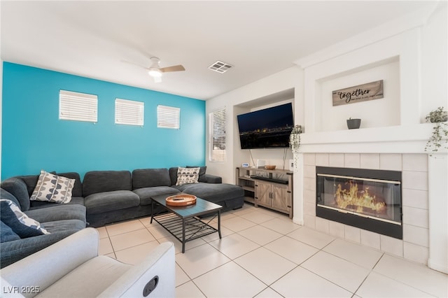 8179 Palace Monaco Ave, Las Vegas, NV 89117 - living area with a ceiling fan, a fireplace, and light tile patterned floors