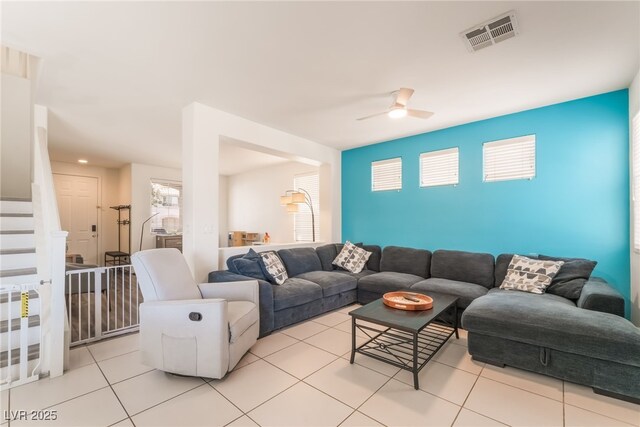 8179 Palace Monaco Ave, Las Vegas, NV 89117 - living area with a ceiling fan, light tile patterned floors, and stairway