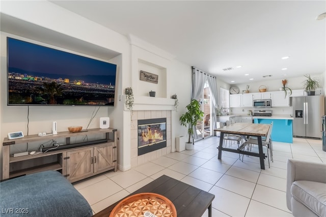 8179 Palace Monaco Ave, Las Vegas, NV 89117 - living room with light tile patterned floors, a fireplace, and recessed lighting