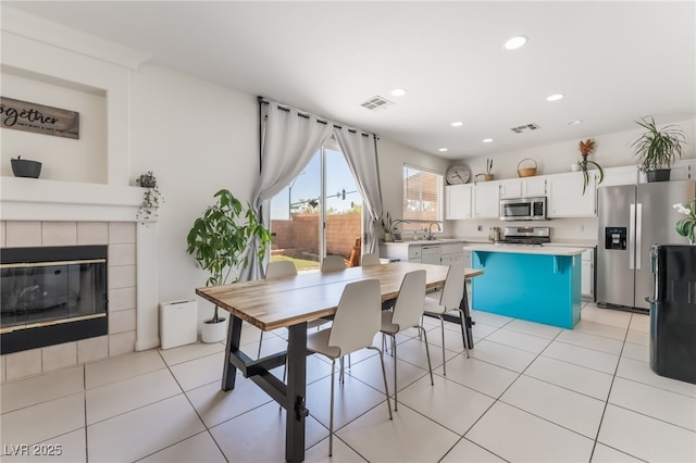 8179 Palace Monaco Ave, Las Vegas, NV 89117 - dining room featuring recessed lighting and a fireplace