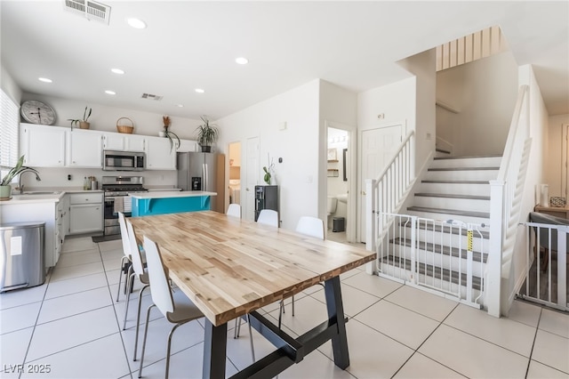 8179 Palace Monaco Ave, Las Vegas, NV 89117 - dining space featuring stairs, recessed lighting, and light tile patterned flooring