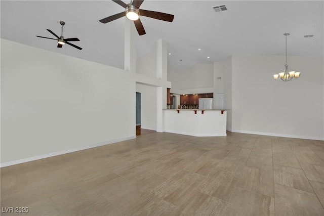 4423 Sophia Way N, Las Vegas, NV 89032 - unfurnished living room with a chandelier, a ceiling fan, high vaulted ceiling, light wood-style flooring, and recessed lighting