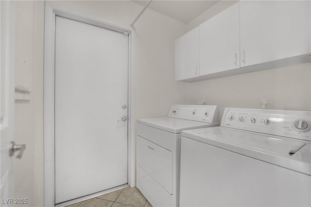 4423 Sophia Way N, Las Vegas, NV 89032 - washroom featuring washer and dryer, cabinet space, and light tile patterned floors