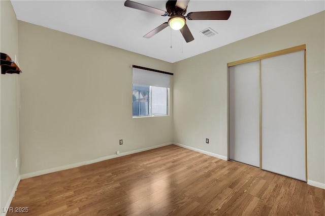 4423 Sophia Way N, Las Vegas, NV 89032 - unfurnished bedroom with wood finished floors, a closet, and a ceiling fan