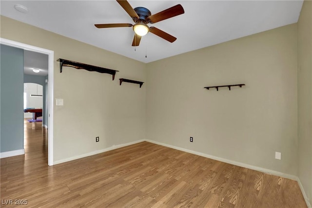 4423 Sophia Way N, Las Vegas, NV 89032 - spare room with light wood-type flooring, ceiling fan, and arched walkways
