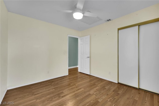 4423 Sophia Way N, Las Vegas, NV 89032 - unfurnished bedroom featuring wood finished floors, a closet, and a ceiling fan