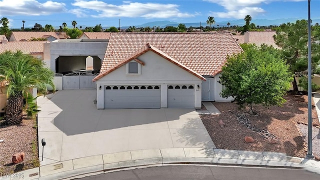4423 Sophia Way N, Las Vegas, NV 89032 - mediterranean / spanish-style house with a tiled roof, a gate, stucco siding, and a garage