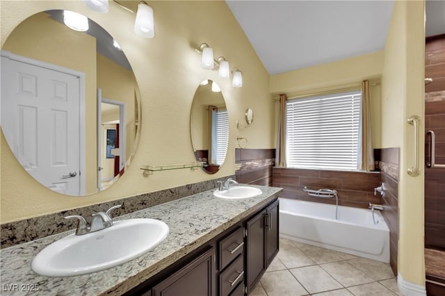 4423 Sophia Way N, Las Vegas, NV 89032 - bathroom featuring tile patterned floors, a bath, lofted ceiling, and double vanity