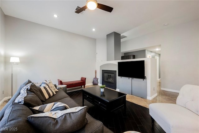2547 Sundew Ave, Henderson, NV 89052 - living room with ceiling fan, recessed lighting, and a glass covered fireplace