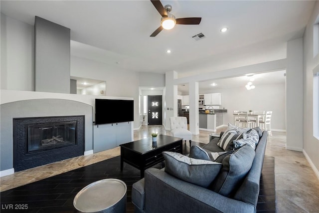 2547 Sundew Ave, Henderson, NV 89052 - living area featuring ceiling fan, recessed lighting, and a glass covered fireplace