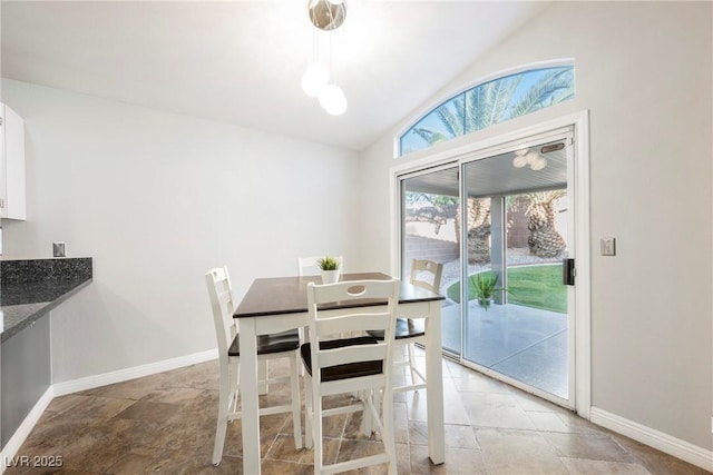 2547 Sundew Ave, Henderson, NV 89052 - dining space featuring vaulted ceiling and light stone finish flooring