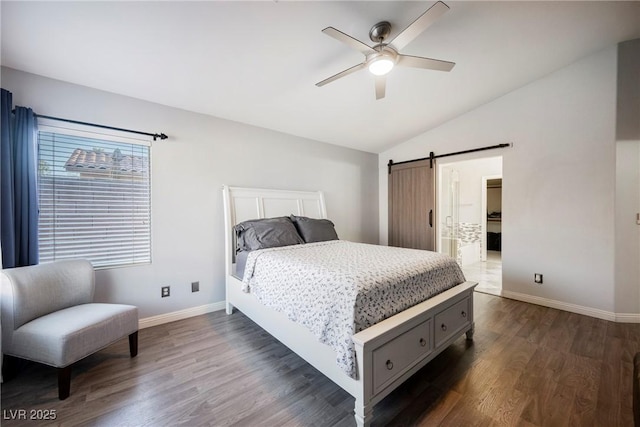 2547 Sundew Ave, Henderson, NV 89052 - bedroom with vaulted ceiling, a barn door, dark wood-style flooring, and ceiling fan
