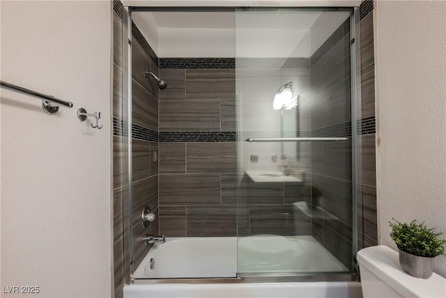 2547 Sundew Ave, Henderson, NV 89052 - bathroom featuring toilet and combined bath / shower with glass door