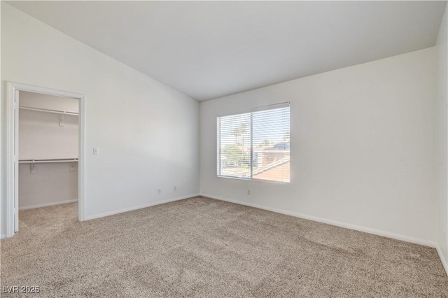 9520 Silver Frost St, Las Vegas, NV 89123 - unfurnished bedroom featuring carpet floors, vaulted ceiling, and a spacious closet