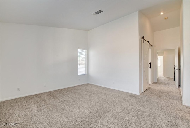 9520 Silver Frost St, Las Vegas, NV 89123 - spare room featuring light colored carpet and a barn door