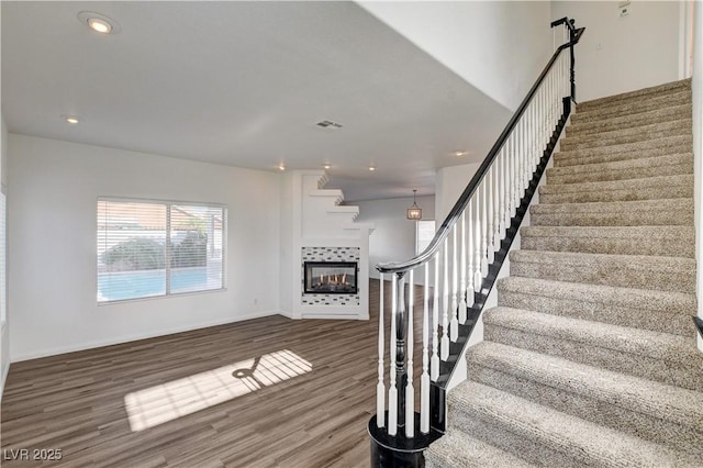 9520 Silver Frost St, Las Vegas, NV 89123 - staircase featuring wood finished floors, a fireplace, and recessed lighting