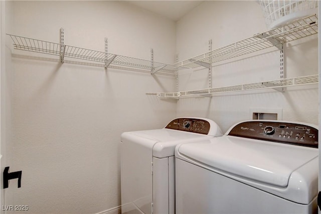 9520 Silver Frost St, Las Vegas, NV 89123 - laundry area with separate washer and dryer and baseboards