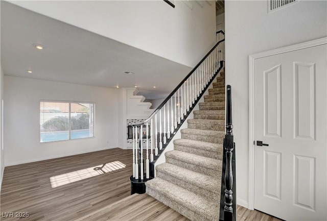 9520 Silver Frost St, Las Vegas, NV 89123 - stairway featuring wood finished floors and recessed lighting