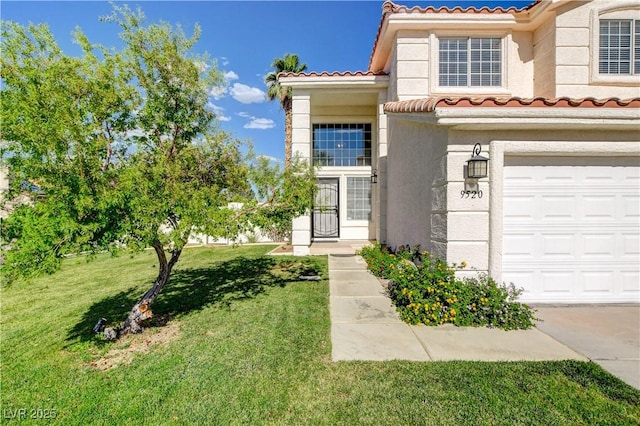 9520 Silver Frost St, Las Vegas, NV 89123 - view of front of home with a tiled roof, a front yard, stucco siding, and a garage