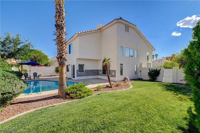 9520 Silver Frost St, Las Vegas, NV 89123 - rear view of property featuring stucco siding, a fenced backyard, and a patio area