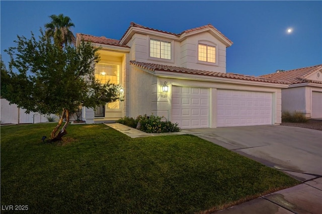 9520 Silver Frost St, Las Vegas, NV 89123 - mediterranean / spanish-style home featuring a tiled roof, driveway, a front yard, a garage, and stucco siding