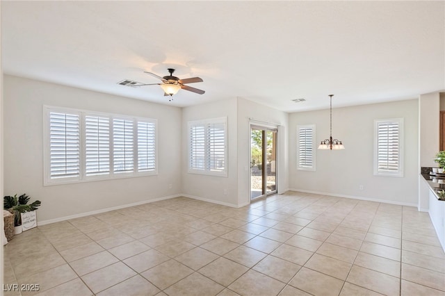 2425 Sky Watcher St, Henderson, NV 89044 - spare room with light tile patterned floors, ceiling fan, and a chandelier