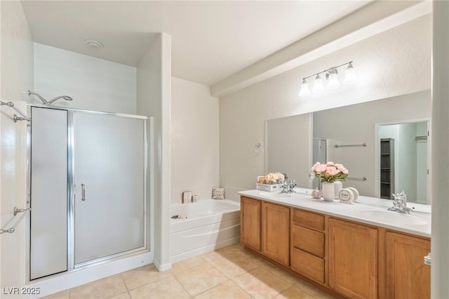 2425 Sky Watcher St, Henderson, NV 89044 - bathroom featuring a shower stall, tile patterned flooring, a garden tub, and double vanity
