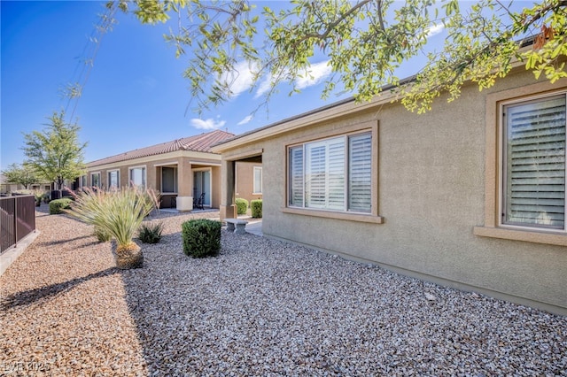 2425 Sky Watcher St, Henderson, NV 89044 - rear view of house featuring stucco siding and a patio area