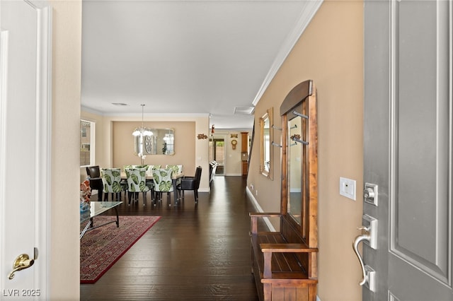 209 Centocelle Ave, Las Vegas, NV 89183 - entryway with crown molding, dark wood-style flooring, and a chandelier