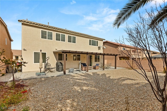 209 Centocelle Ave, Las Vegas, NV 89183 - back of house featuring stucco siding, a fenced backyard, and a patio