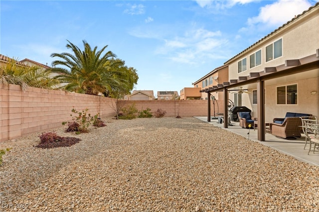 209 Centocelle Ave, Las Vegas, NV 89183 - fenced backyard with an outdoor hangout area, a patio area, and ceiling fan