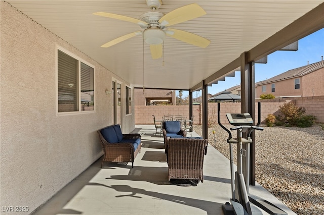 209 Centocelle Ave, Las Vegas, NV 89183 - fenced backyard featuring an outdoor hangout area, a patio, and a ceiling fan