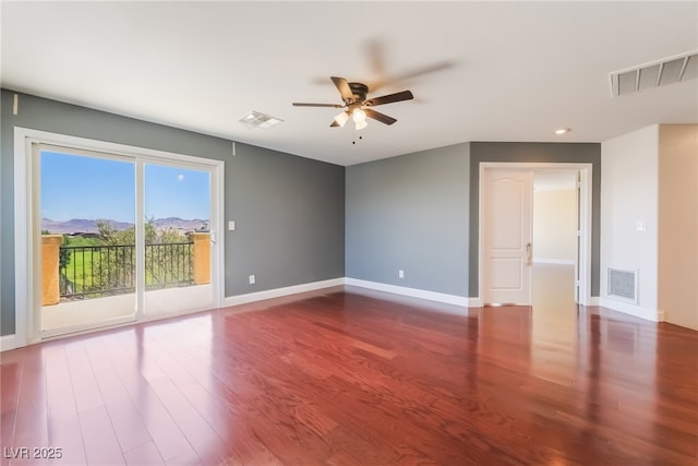 1152 Highbury Grove St, Henderson, NV 89002 - spare room featuring ceiling fan, wood finished floors, a mountain view, and recessed lighting