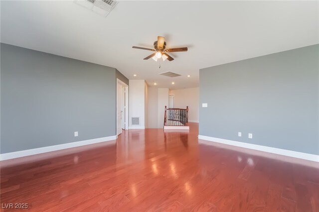 1152 Highbury Grove St, Henderson, NV 89002 - unfurnished living room featuring a ceiling fan, wood finished floors, and recessed lighting