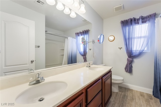 1152 Highbury Grove St, Henderson, NV 89002 - full bath with double vanity, wood finished floors, and curtained shower