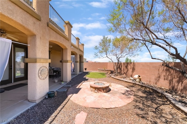 1152 Highbury Grove St, Henderson, NV 89002 - fenced backyard featuring an outdoor fire pit, a patio area, and a balcony