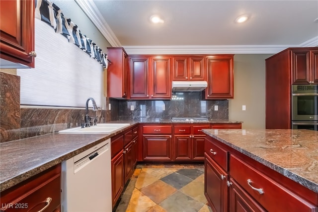 1152 Highbury Grove St, Henderson, NV 89002 - kitchen with stainless steel appliances, under cabinet range hood, dark brown cabinets, ornamental molding, and decorative backsplash