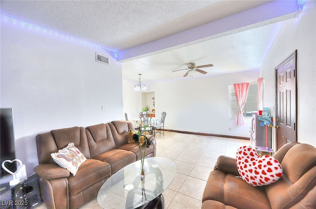 304 N Minnesota St, Las Vegas, NV 89107 - living room with a ceiling fan, a chandelier, light tile patterned floors, and a textured ceiling
