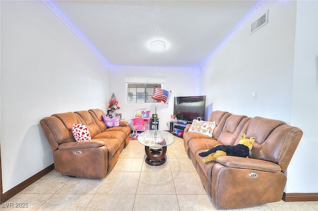 304 N Minnesota St, Las Vegas, NV 89107 - living area featuring crown molding, a textured ceiling, and light tile patterned flooring