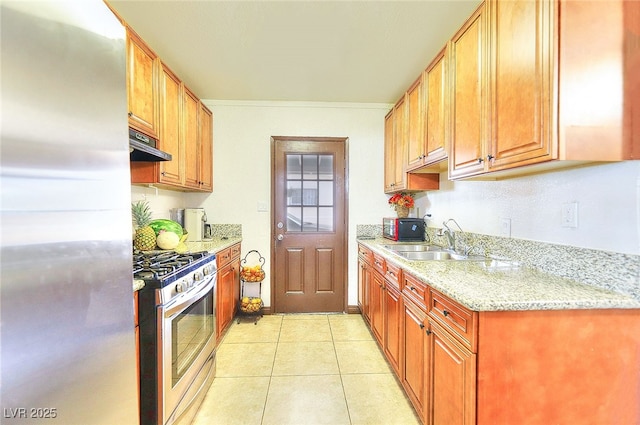 304 N Minnesota St, Las Vegas, NV 89107 - kitchen with appliances with stainless steel finishes, light tile patterned floors, light stone counters, and exhaust hood