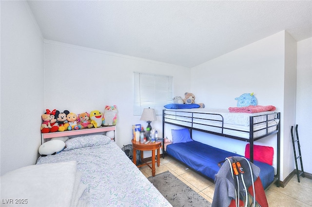 304 N Minnesota St, Las Vegas, NV 89107 - bedroom with tile patterned flooring and a textured ceiling