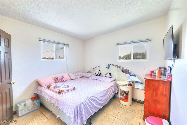 304 N Minnesota St, Las Vegas, NV 89107 - tiled bedroom with a textured ceiling and ornamental molding