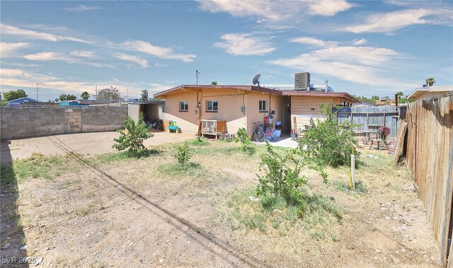 304 N Minnesota St, Las Vegas, NV 89107 - back of house with a fenced backyard and a patio area