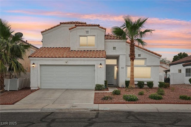 9405 Crosspointe Ave, Las Vegas, NV 89117 - mediterranean / spanish-style home featuring a tiled roof, concrete driveway, and stucco siding