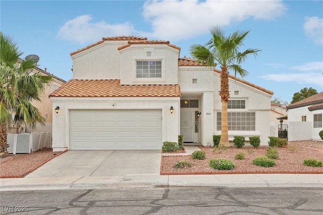 9405 Crosspointe Ave, Las Vegas, NV 89117 - mediterranean / spanish home with a tile roof, stucco siding, driveway, and a garage